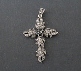 Expertly crafted with high-quality silver and mesmerizing marcasite and onyx stones, the Cross Silver 925 Armenian Spirit necklace exudes luxury and mysticism. This large jewelry piece makes a perfect gift for any woman who loves dark and elegant accessories. It is also hypoallergenic, ensuring maximum comfort and style for the wearer.