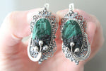 Discover the beauty of Armenian craftsmanship with our high quality 925 silver jewelry. Adorn your ears with the vibrant green malachite earrings, featuring vintage filigree designs reminiscent of your grandmother's treasured collection. Elevate your style and support talented artisans by buying online today. Buy online green gem earrings like for queen dress matching.