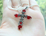 This elegant cross necklace is crafted from high quality silver and adorned with sparkling marcasite and a vibrant red topaz stone. Its unique design captures the essence of Armenia's rich cultural heritage. Perfect for any occasion, this piece will add a touch of sophistication to any outfit, especially when paired with a red dress. Elevate your style with the Armenian Spirit necklace.