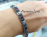 Expertly crafted with traditional ethnic design, this bracelet features real garnet stones that exude a boho and beachy vibe. Made with Sterling silver 925 and inspired by Armenian heritage, this piece is perfect for those who love to embrace culture and spirituality. Radiate love and positive energy with this bracelet's garnet love stones.