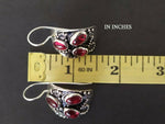 Expencive vintage! Old fashioned jewelry. These earrings looks like a real vintage old earringe. The earrings are made of silver 925 and garnet gemstones. The earlobe closure is hook. Th earrings are hooked. The stones are deep red and the silver is oxidised, so it looks black. Black and red jewelry in vintage goes well with elegant vouguish dresses and coats.