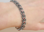 This luxurious silver bracelet is adorned with sparkling marcasite stones, adding elegance and glamour to any outfit. Made with high-quality 925 sterling silver, it is perfect for a rich and sophisticated woman looking to make a statement at a cocktail party or any special occasion. Elevate your style with an Armenian Spirit.