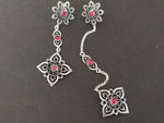 Add a touch of Armenian tradition to your wardrobe with our delicate silver 925 stud earrings featuring intricate red flower designs. Each earring is adorned with a red stone, making it a perfect accessory for any occasion. Elevate your style and show off your cultural pride with these stunning earrings.