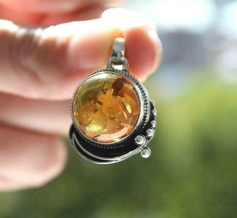 This honey amber pendant is a one of a kind piece, with a round natural gem that exudes affordable charm. Handcrafted to perfection, this pendant is a budget-friendly option for those looking for unique, natural jewelry. This round honey amber pendant is one of a kind, featuring a natural gem that is both affordable and cheap. Its unique design makes it the perfect addition to any jewelry collection. Made from high-quality materials, this pendant is both durable and stunning.

