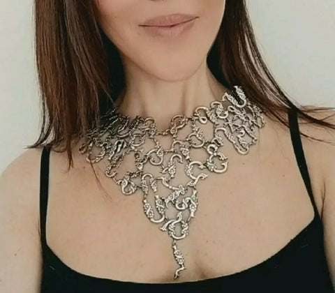 Armenian ethnic traditional necklace made of sterling silver covering the chest with rows. This large Armenian chest collar was made by Armenian artisans. The necklace consists of Armenian old alphabet with trchnagir letters in taraz ethnic Erzrum style. This kinds of Armenian necklaces were popular among Kars, Van, Mush, Adana, Ani women. The necklace is quite heavy and covering the neck and chest.