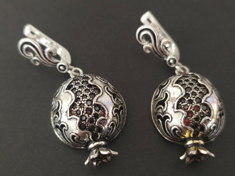 These Armenian pomegranate earrings are made of sterling silver 925 and faceted garnet gemstones. The earrings are long hollow pomegranates with Armenian tradtional ornamnet. You can buy these pomegranate earrings as a gift for a bride, girlfriend or beloved woman. It is a symbol of a true love a serious intentions in Armenian culture.