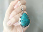 Looking for the perfect gift for that special vintage lover in your life? This handmade Turquoise pendant, adorned with delicate floral details, is the perfect addition to any woman's jewelry collection. Its vibrant blue color will beautifully complement any outfit, making it a versatile and thoughtful gift for any occasion. Made with high-quality Sterling Silver 925, this pendant is a unique and timeless piece that is sure to be cherished for years to come.