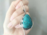 Looking for the perfect gift for that special vintage lover in your life? This handmade Turquoise pendant, adorned with delicate floral details, is the perfect addition to any woman's jewelry collection. Its vibrant blue color will beautifully complement any outfit, making it a versatile and thoughtful gift for any occasion. Made with high-quality Sterling Silver 925, this pendant is a unique and timeless piece that is sure to be cherished for years to come.
