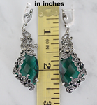 Searching for a high class silver precious jewelry? These green emerald color stones earrings are long and eye catching. The stones are topaz and black onyx. There are small marcasite stones on it which made them more classy and elegant. The length of the earrings is about 3 inches.