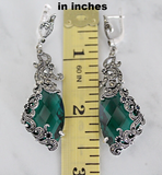 Searching for a high class silver precious jewelry? These green emerald color stones earrings are long and eye catching. The stones are topaz and black onyx. There are small marcasite stones on it which made them more classy and elegant. The length of the earrings is about 3 inches.