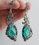 Emerald green earrings which suits to emerald green long dress with open shoulders and large neckline. The earrings are long and classy, will look elegant and chic on any woman. The green color will make more beutiful green eyed woman.