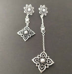 These stud earrings are a beautiful addition to any jewelry collection. Made of 925 silver and adorned with delicate pearl flowers, they are a stunning representation of Western Armenian Anatolian jewelry. Perfect for weddings or special occasions, they add a touch of elegance and femininity to any look.