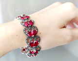 Indulge in luxury with our chic Armenian Spirit bracelet! Crafted from precious sterling silver 925, this rich red bracelet will elevate any outfit. Embrace the rich culture of Armenia and add a touch of Dubai's elegance to your style. Truly a must-have for any jewelry collection!