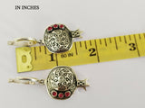 Buy Armenian made sterling silver earrings in a shape of pomegranate with herbal ornament and red garnet stones.