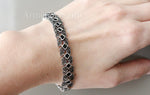 Expertly crafted for the sophisticated and luxurious woman, this silver bracelet features black square onyx stones and marcasite detailing. Made from high-quality 925 silver, this bracelet is the perfect gift for a special occasion or to add a touch of elegance to any outfit. Elevate your look with this stunning Armenian-inspired piece.