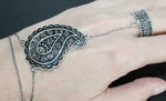 Paisley jewelry, with its traditional  teardrop Indian motif, carries a timeless elegance and a bohemian flair. When crafted in sterling silver 925, and especially when paired with an attached band ring, it becomes a statement piece that effortlessly blends sophistication with a touch of the unconventional. My experience with this type of jewelry has generally been positive, offering a unique and versatile option for accessorizing.

