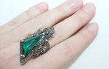 Large ring with emerald green gemstone triangle and bow with marcasites on it. Very large sizes of the ring US size chart buy online from Armenian Spirit jewelry store with Free shipping Worldwide and discounts.